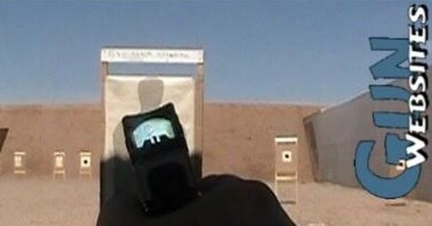 An IWB holster for a Glock 19 with a red dot, on the range
