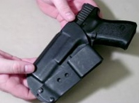 An inside the waistband holster held in hand