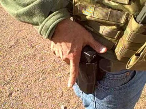 A Safariland ALS retention holster worn on the belt