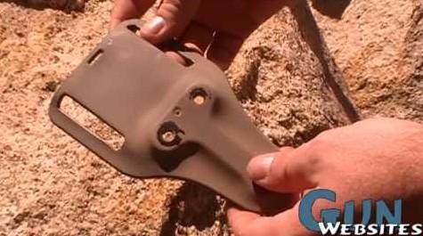 A Safariland holster mounted to a belt adaptor