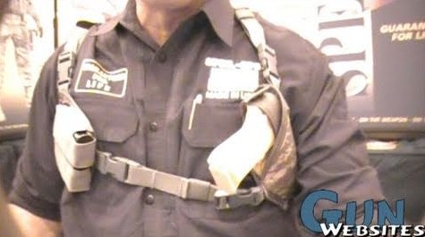 A shoulder holster rig worn over a shirt