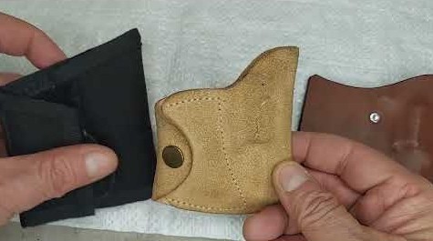 Stiff leather pocket holsters shown side by side